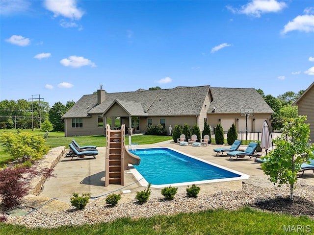 111 Foristell Ridge Ct, Foristell, MO 63348 - view of swimming pool featuring a patio and a water slide