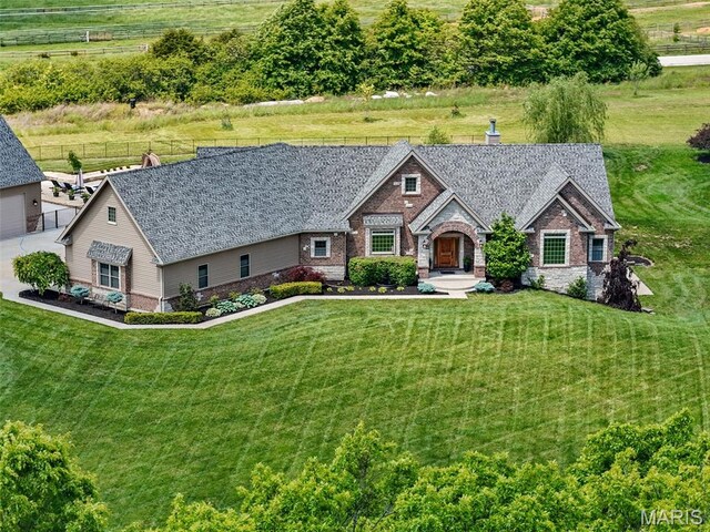 111 Foristell Ridge Ct, Foristell, MO 63348 - view of front of home featuring brick siding and a chimney