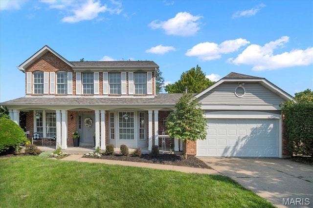 300 Wildberry Ln, Saint Charles, MO 63304 - view of front of home with brick siding, concrete driveway, an attached garage, and a front yard