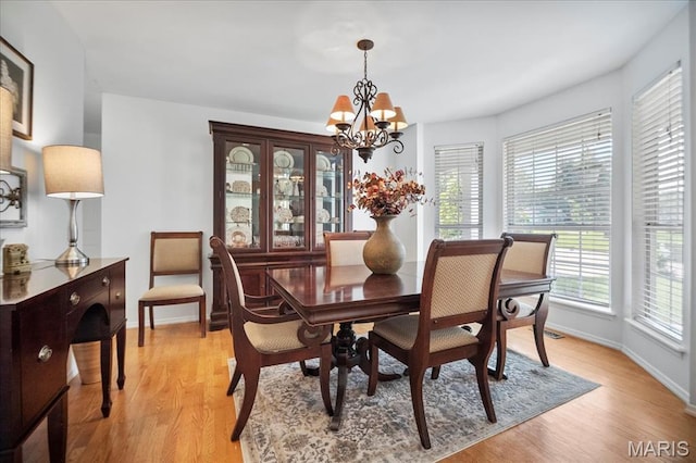 300 Wildberry Ln, Saint Charles, MO 63304 - dining area featuring a chandelier and light wood finished floors