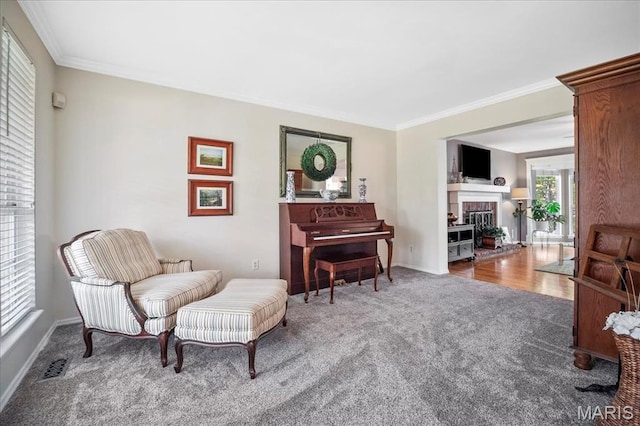 300 Wildberry Ln, Saint Charles, MO 63304 - sitting room with carpet, ornamental molding, and a fireplace