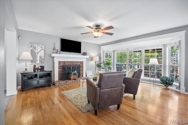 300 Wildberry Ln, Saint Charles, MO 63304 - living room featuring a fireplace, a ceiling fan, and wood finished floors