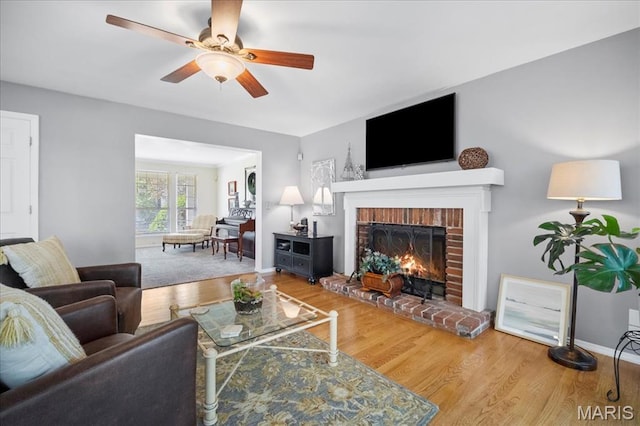 300 Wildberry Ln, Saint Charles, MO 63304 - living area featuring a fireplace, wood finished floors, and a ceiling fan