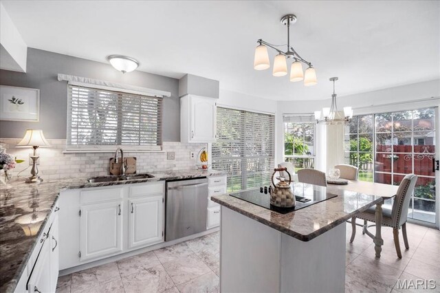 300 Wildberry Ln, Saint Charles, MO 63304 - kitchen with dishwasher, black electric cooktop, a chandelier, light stone counters, and a kitchen island
