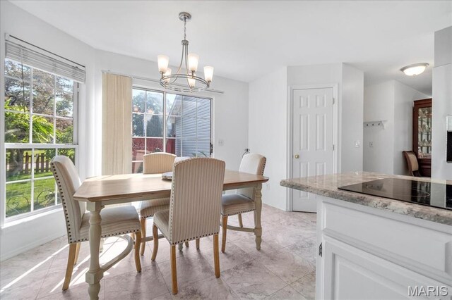 300 Wildberry Ln, Saint Charles, MO 63304 - dining area with a chandelier and light tile patterned floors