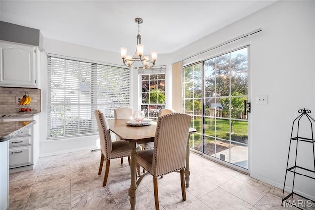 300 Wildberry Ln, Saint Charles, MO 63304 - dining area featuring a chandelier and baseboards