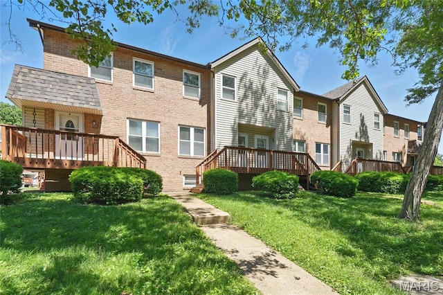 10161 Squire Meadows Drive E, Saint Louis, MO 63123 - back of property featuring a deck, brick siding, and a lawn