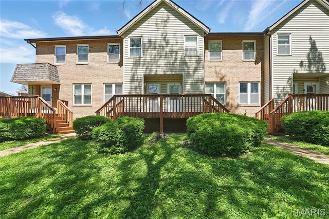 10161 Squire Meadows Drive E, Saint Louis, MO 63123 - back of house with a wooden deck, brick siding, and a yard