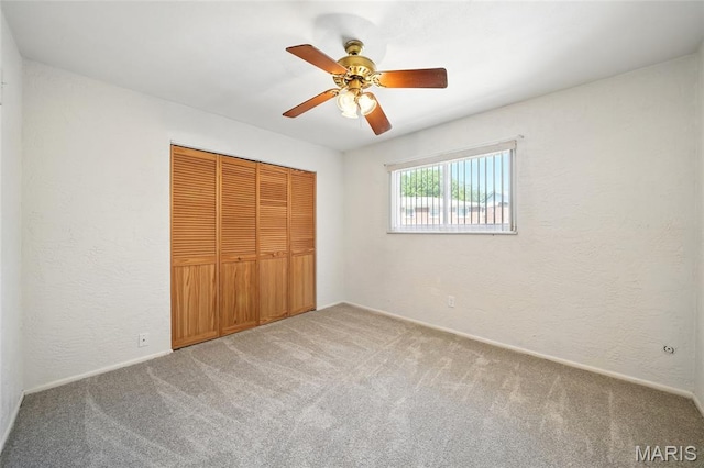 10161 Squire Meadows Drive E, Saint Louis, MO 63123 - unfurnished bedroom featuring carpet flooring, a closet, and ceiling fan
