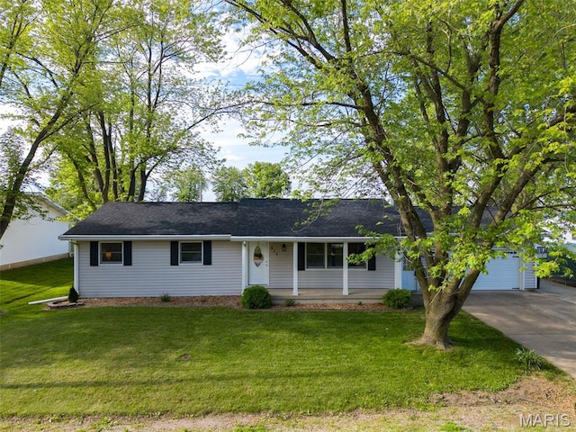 511 E Wilson St, Beckemeyer, IL 62219 - single story home featuring concrete driveway, a front yard, covered porch, and a garage
