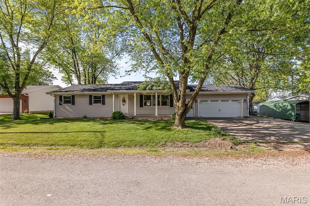 511 E Wilson St, Beckemeyer, IL 62219 - ranch-style home with an attached garage, driveway, and a front lawn