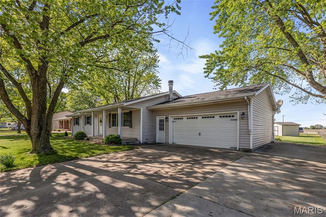 511 E Wilson St, Beckemeyer, IL 62219 - single story home featuring concrete driveway, an attached garage, a front yard, and covered porch