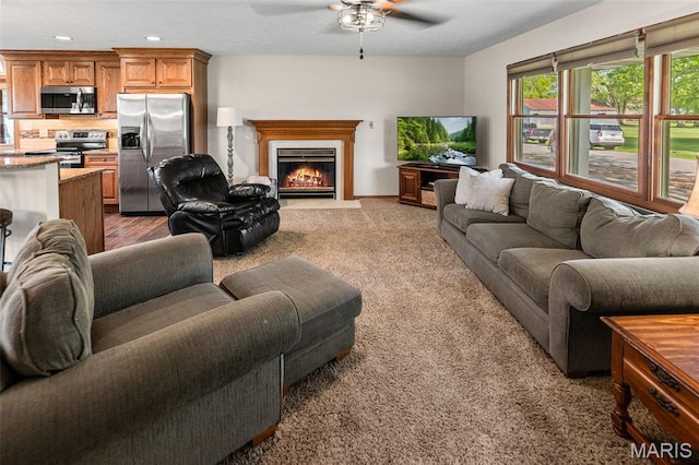 511 E Wilson St, Beckemeyer, IL 62219 - living area with a ceiling fan, a fireplace with flush hearth, light carpet, and recessed lighting