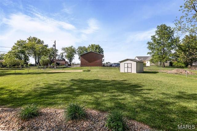 511 E Wilson St, Beckemeyer, IL 62219 - view of yard with a storage shed and an outbuilding