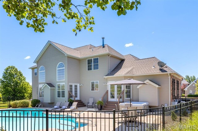 5316 Enchanted Ct, Weldon Spring, MO 63304 - rear view of property with french doors, entry steps, a patio area, and a shingled roof