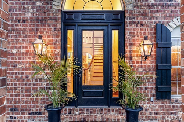 5316 Enchanted Ct, Weldon Spring, MO 63304 - view of exterior entry with brick siding and french doors