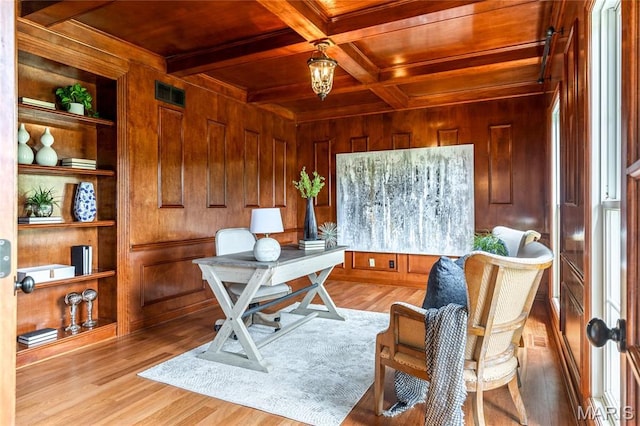 5316 Enchanted Ct, Weldon Spring, MO 63304 - home office featuring a wooden ceiling with exposed beams, wood walls, built in shelves, wood finished floors, and ornamental molding