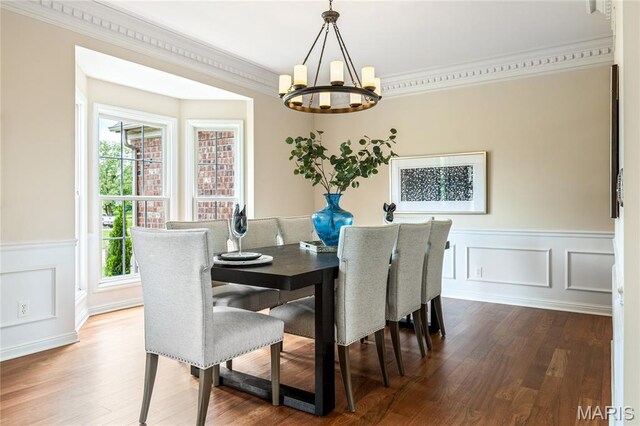 5316 Enchanted Ct, Weldon Spring, MO 63304 - dining room with a chandelier, crown molding, wood finished floors, wainscoting, and a decorative wall