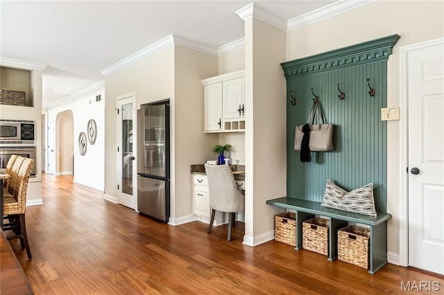 5316 Enchanted Ct, Weldon Spring, MO 63304 - mudroom with crown molding, dark wood-style flooring, and arched walkways