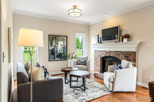 5316 Enchanted Ct, Weldon Spring, MO 63304 - living room featuring a fireplace, wood finished floors, and crown molding