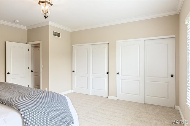 5316 Enchanted Ct, Weldon Spring, MO 63304 - bedroom with multiple closets, light colored carpet, and crown molding