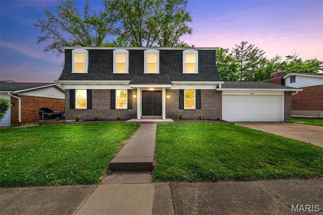 2736 Ashrock Dr, Saint Louis, MO 63129 - view of property with roof with shingles, an attached garage, and a lawn