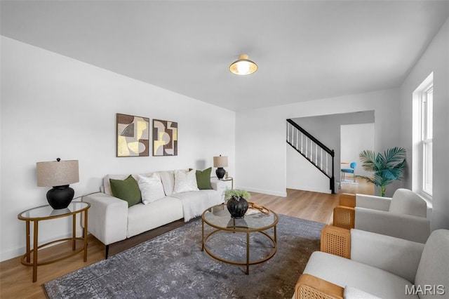 2736 Ashrock Dr, Saint Louis, MO 63129 - living area with stairway, wood finished floors, and baseboards