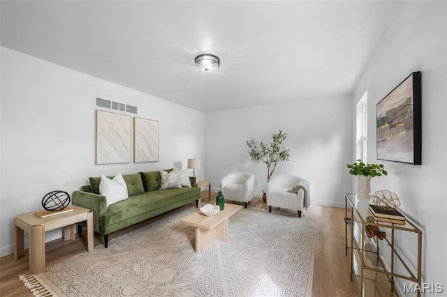 2736 Ashrock Dr, Saint Louis, MO 63129 - living area with wood finished floors and baseboards