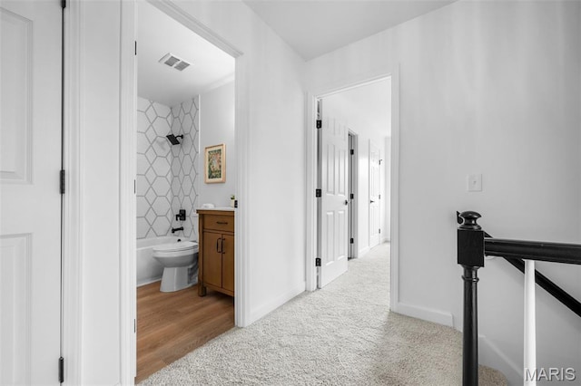 2736 Ashrock Dr, Saint Louis, MO 63129 - hallway featuring an upstairs landing, carpet flooring, and baseboards