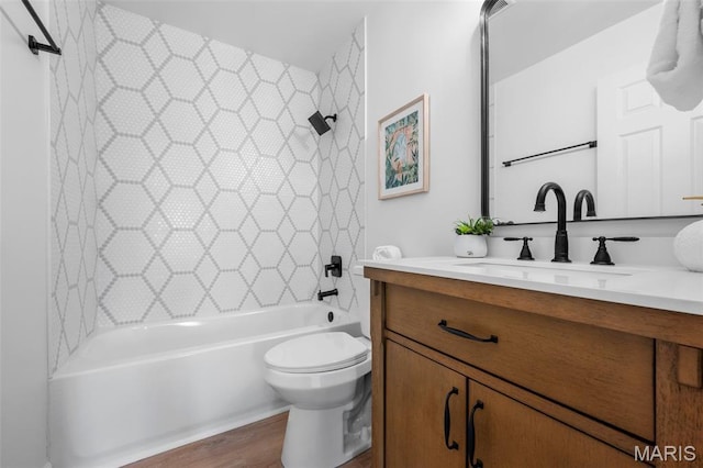 2736 Ashrock Dr, Saint Louis, MO 63129 - full bath with vanity, toilet, shower / bathtub combination, and wood finished floors