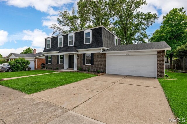 2736 Ashrock Dr, Saint Louis, MO 63129 - front of property with a shingled roof, brick siding, an attached garage, driveway, and mansard roof