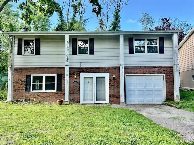 860 Chouteau Ave, Godfrey, IL 62035 - view of front of property with asphalt driveway, brick siding, a front lawn, and an attached garage