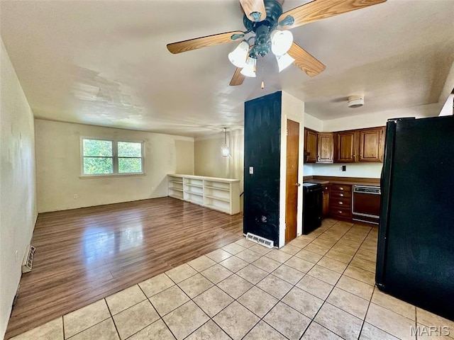860 Chouteau Ave, Godfrey, IL 62035 - kitchen with freestanding refrigerator, dishwasher, light tile patterned flooring, open floor plan, and ceiling fan