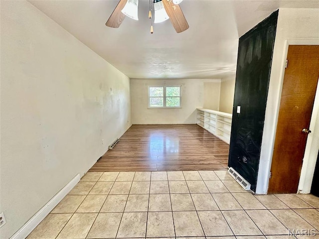 860 Chouteau Ave, Godfrey, IL 62035 - unfurnished room featuring ceiling fan and light tile patterned flooring