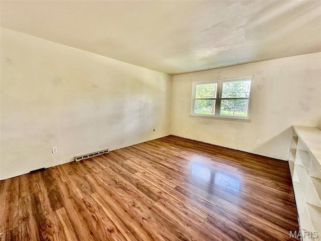 860 Chouteau Ave, Godfrey, IL 62035 - spare room featuring wood finished floors