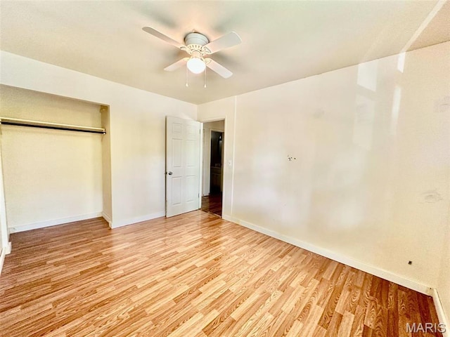 860 Chouteau Ave, Godfrey, IL 62035 - unfurnished bedroom with light wood-style floors, baseboards, and a closet