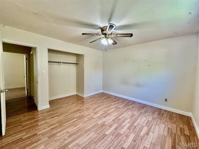 860 Chouteau Ave, Godfrey, IL 62035 - unfurnished bedroom featuring light wood-type flooring, baseboards, a closet, and ceiling fan