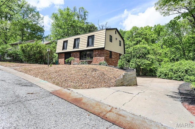 28 French Quarter, Belleville, IL 62223 - view of front of property with brick siding and a gambrel roof