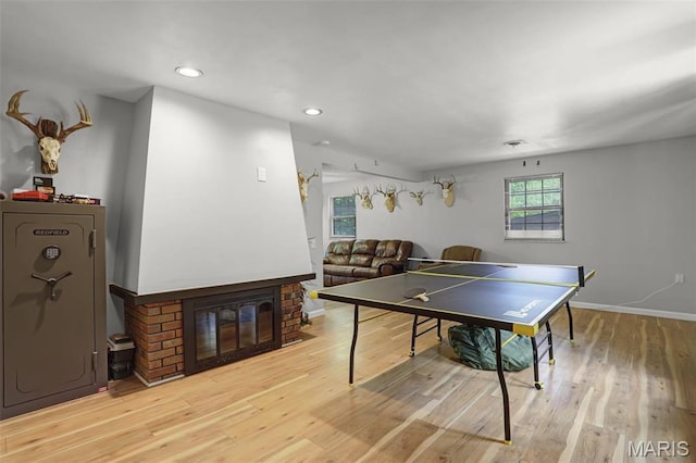 28 French Quarter, Belleville, IL 62223 - rec room featuring light wood-type flooring, recessed lighting, baseboards, and a fireplace