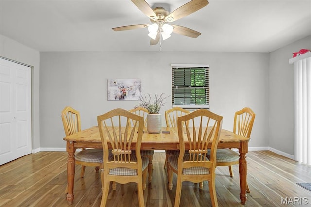 28 French Quarter, Belleville, IL 62223 - dining area featuring light wood finished floors, baseboards, and a ceiling fan
