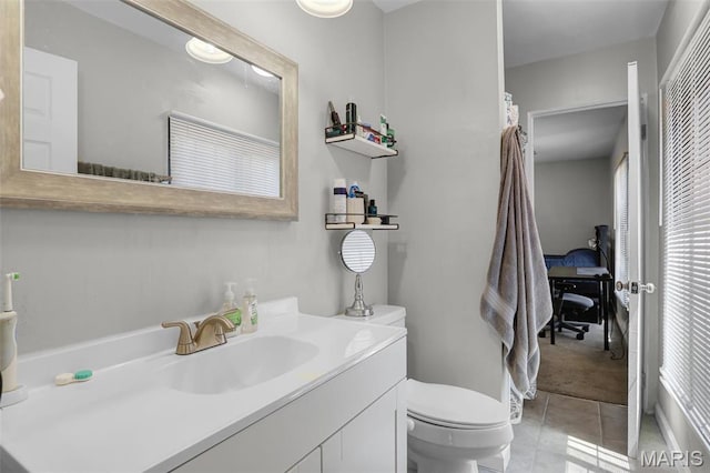 28 French Quarter, Belleville, IL 62223 - bathroom with toilet, tile patterned flooring, and vanity