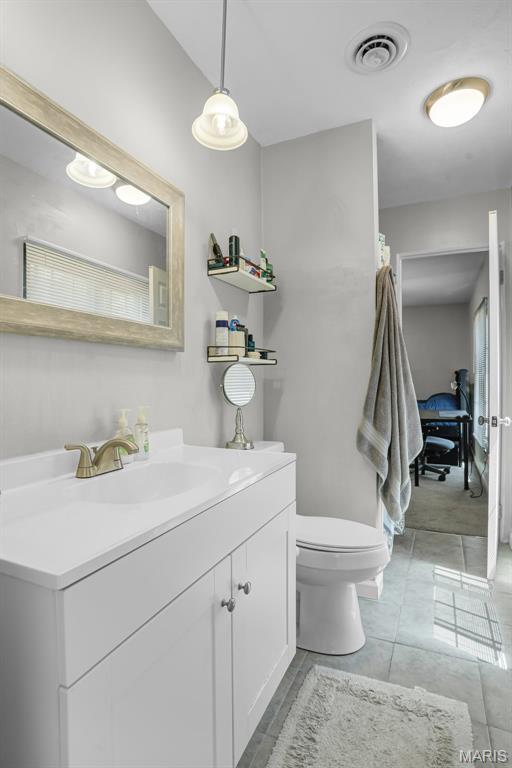 28 French Quarter, Belleville, IL 62223 - bathroom featuring vanity and toilet