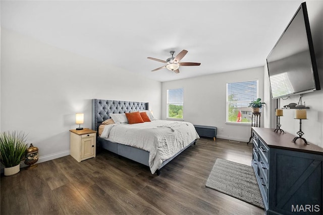 bedroom with baseboards, dark wood finished floors, and ceiling fan