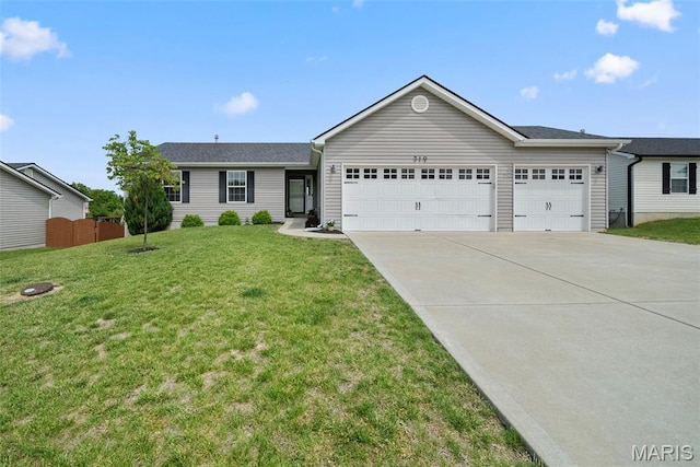 single story home featuring a garage and driveway