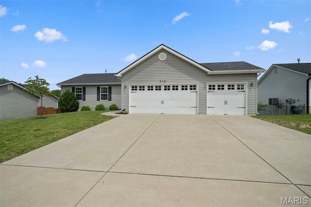 ranch-style home featuring concrete driveway, a garage, a front yard, and central AC