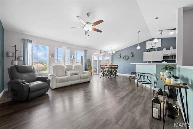 living room featuring ceiling fan, dark wood-type flooring, lofted ceiling, track lighting, and baseboards