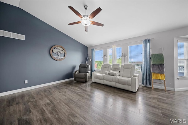 living room with vaulted ceiling, ceiling fan, wood finished floors, and baseboards