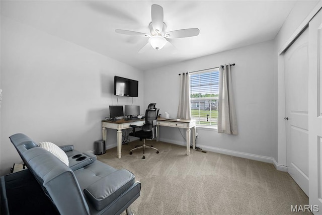home office with carpet floors, baseboards, and ceiling fan