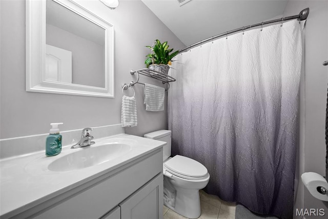 full bathroom featuring toilet, tile patterned floors, and vanity