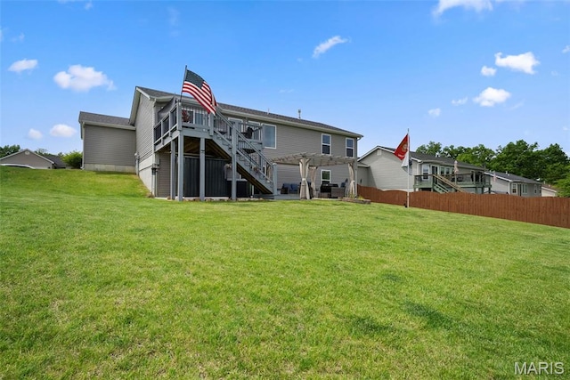 back of house featuring stairs and a deck
